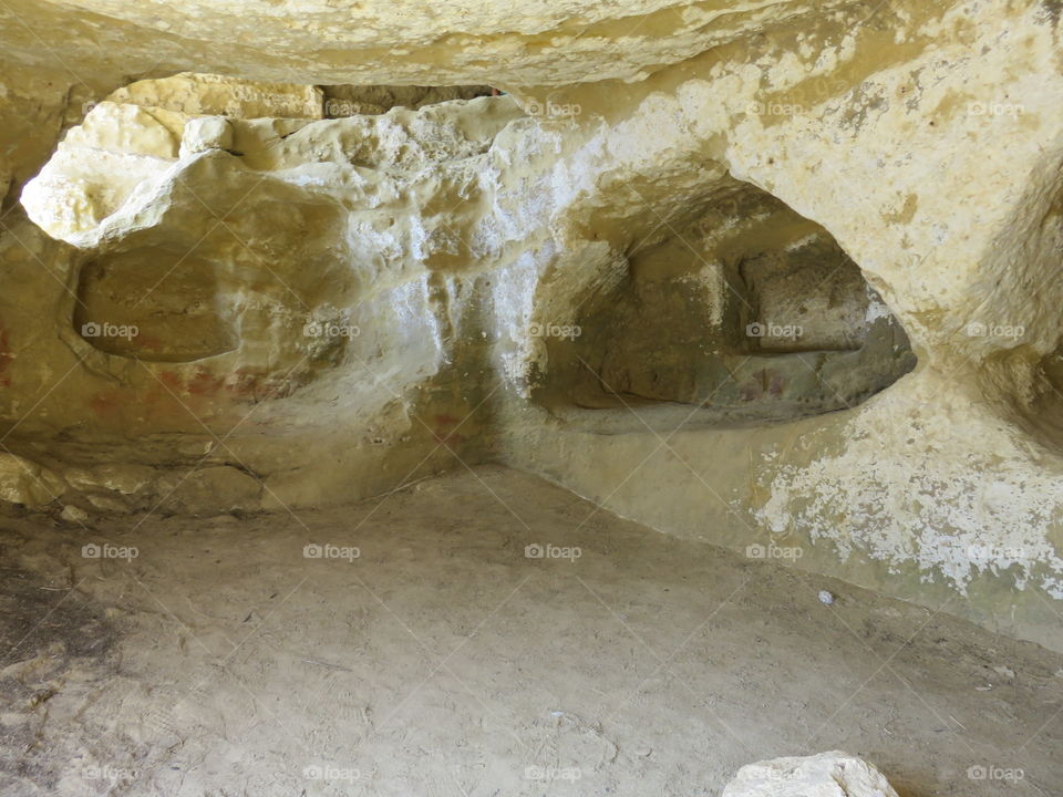 Ancient catacombs in Crete carved in limestone entrance