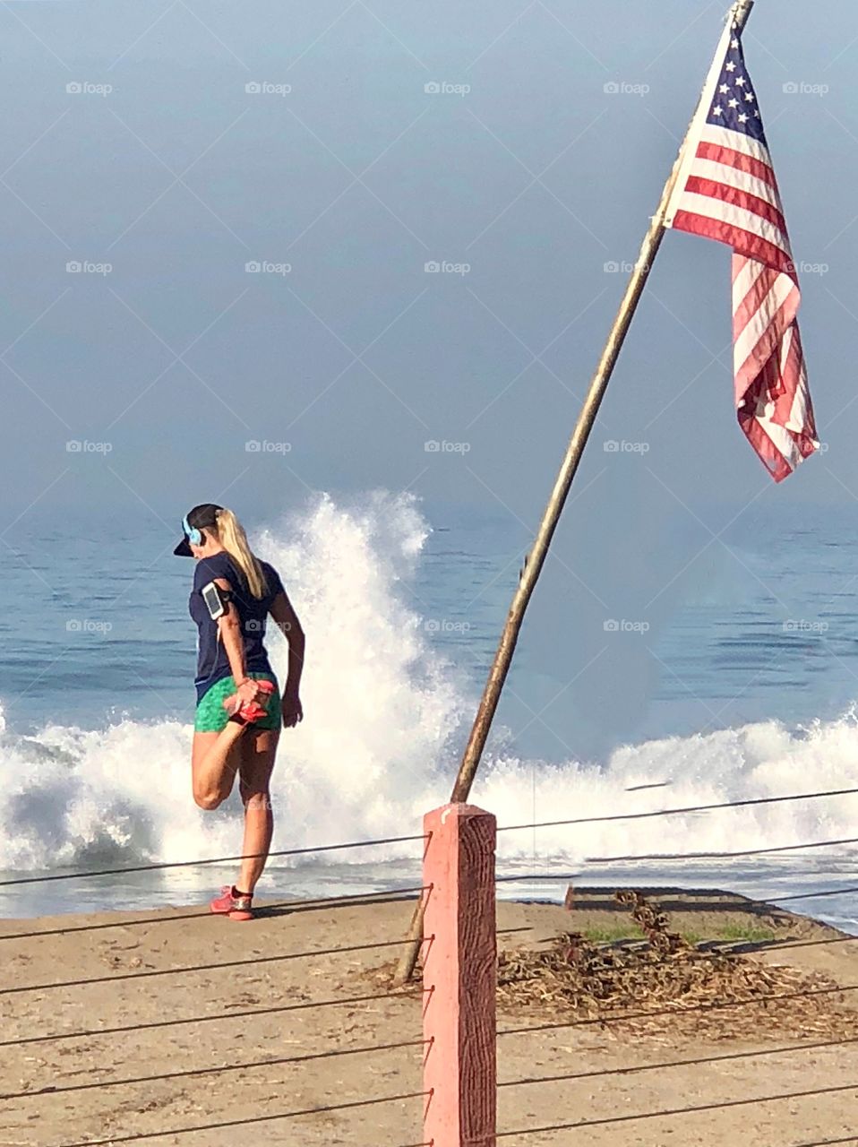 Foap Mission Staying In Shape! Woman Exercising On The Beach With an American Flag 