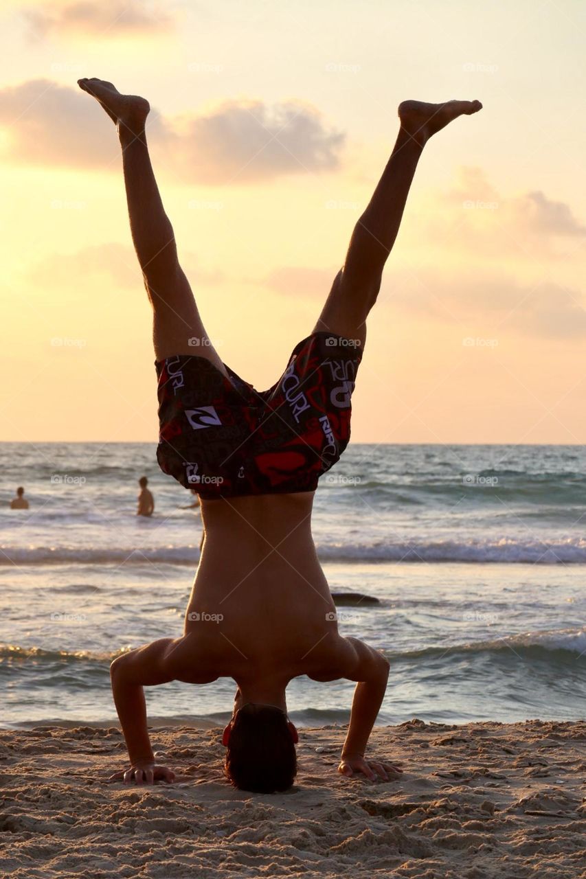 Headstand on the beach