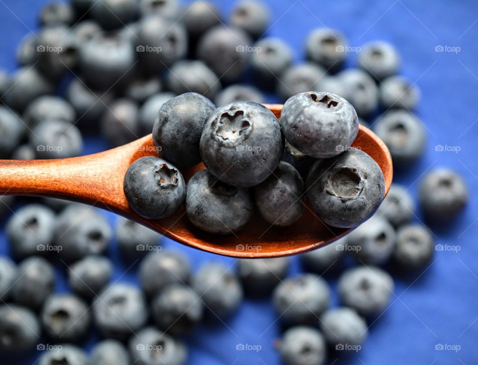 blueberries in the wooden spoon tasty cooking