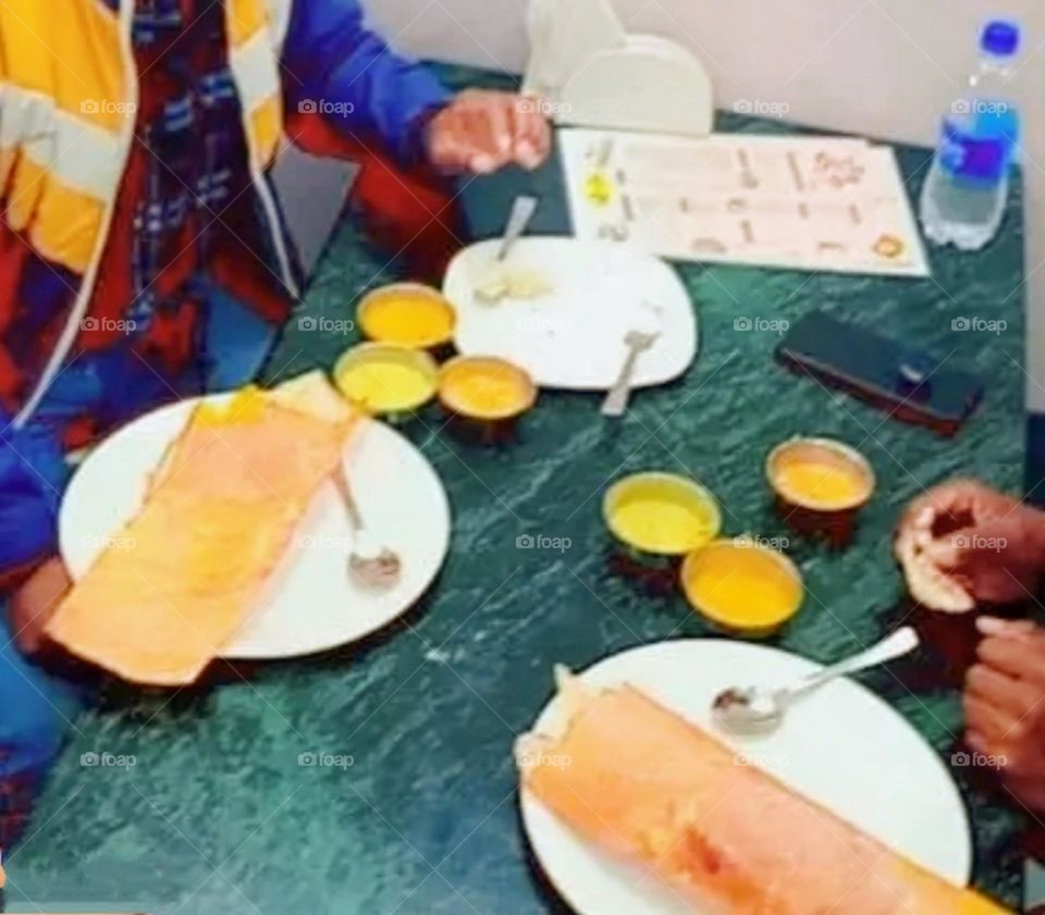 Morning breakfast is being enjoyed at a restaurant.