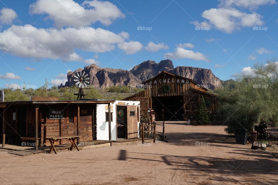 A old movie set designed for a 1960's Elvis Presley movie stands in front of the Superstition Mountain range in Arizona
