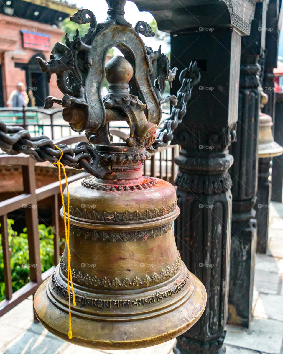 In Hinduism, bells are generally hung at temple dome. Devotees ring bell while entering sanctum. Sound is considered auspicious which welcomes divinity and dispels evil.