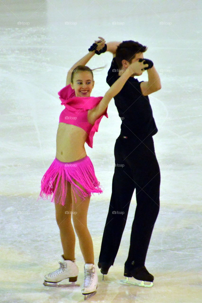 ice skating, dancing couple