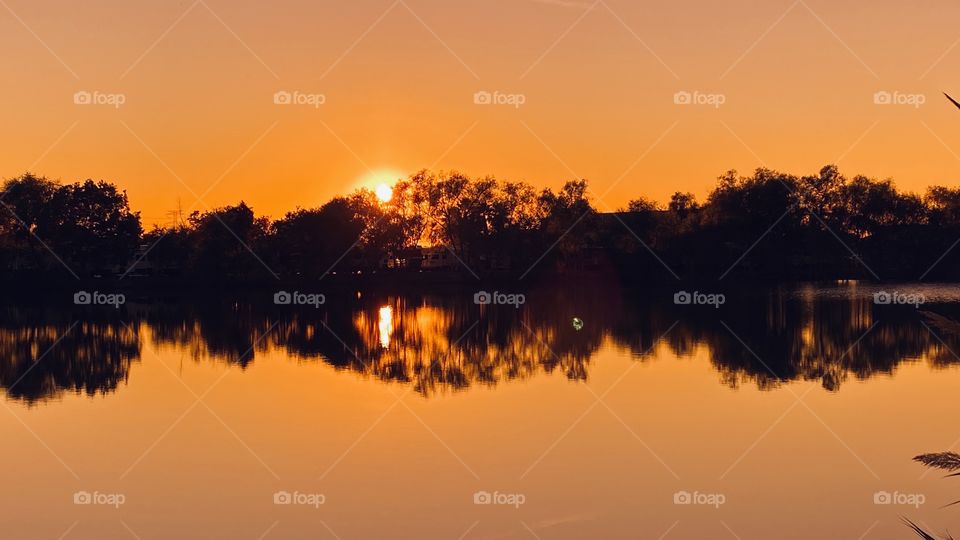 Well this is not only a Gorgeous Sunset lit by a bright setting sun. Refections Strong and Vivid which will remain Vibrant into the Night.