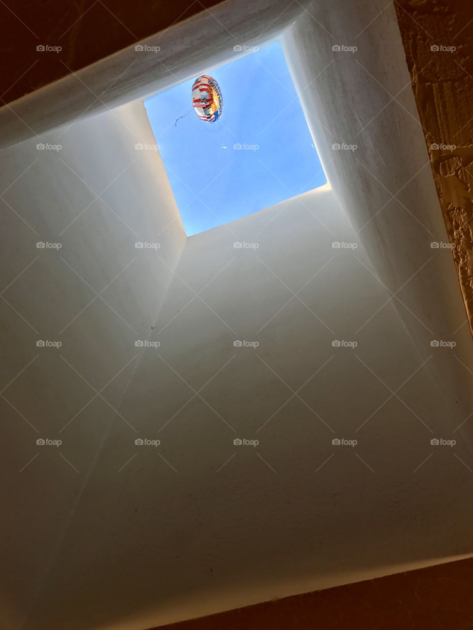 My son’s balloon escaped to the skylight