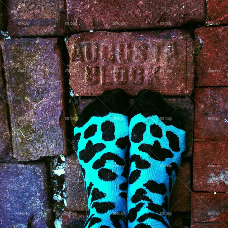 Feet on brick