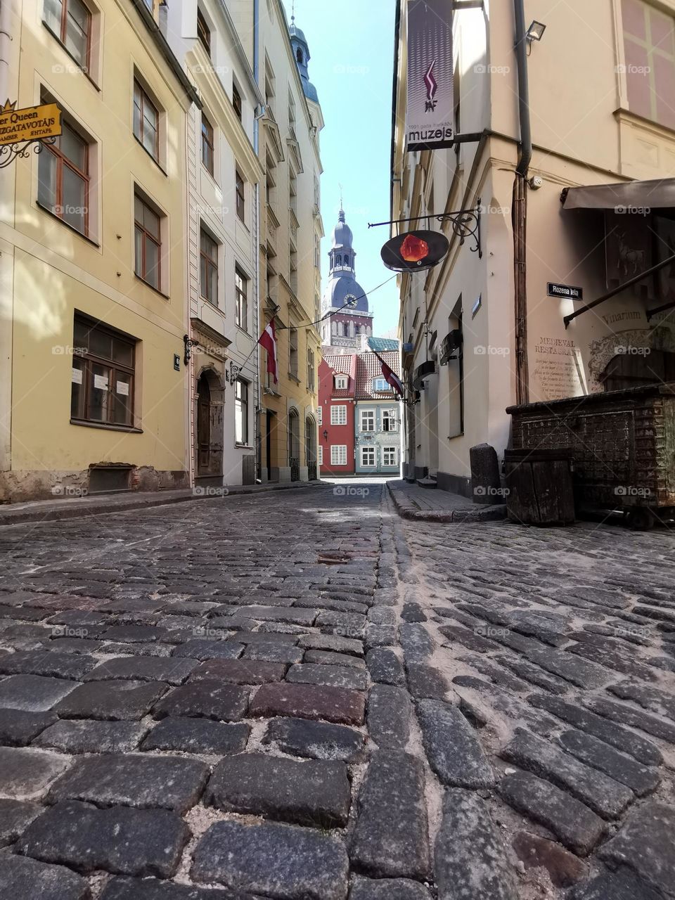 Latvia, Riga, street photo. Old Town Riga. Paving stones. Cathedral. 
Unusual shooting angle. Shooting from below. Down up. From the ground up...