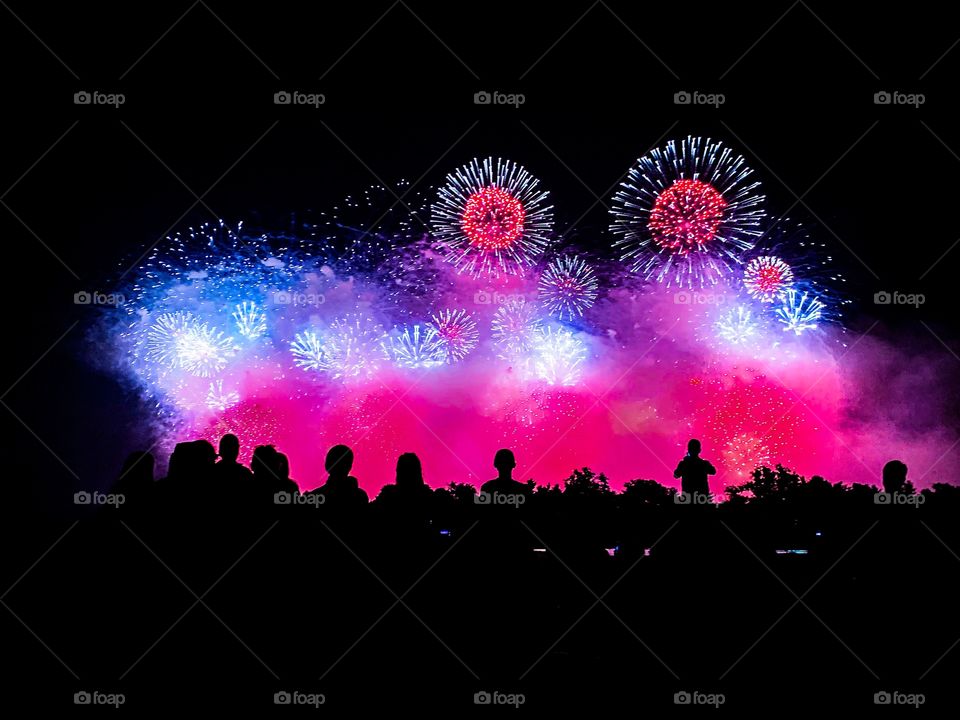 Colorful and bright 4th of July fireworks display light up the night sky in Washington DC. 