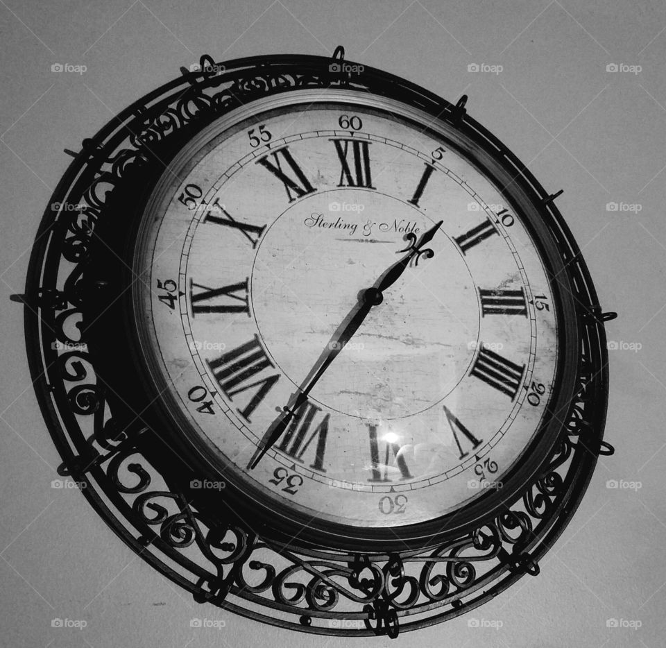 Large ornate metal wall clock.