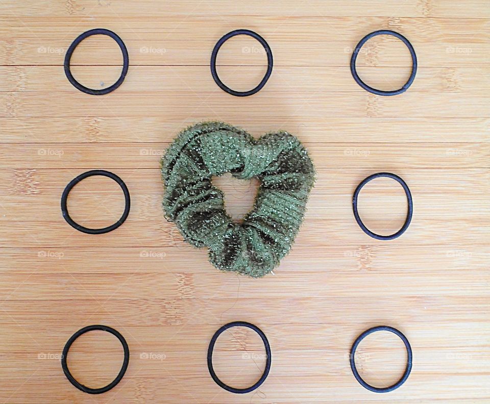 Hair accessories arranged on a wood surface