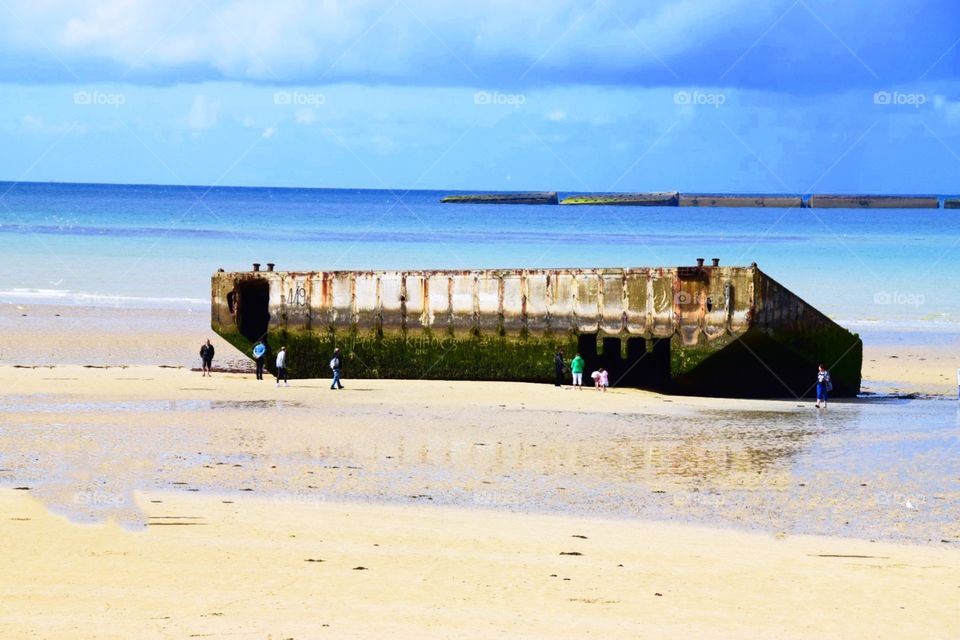 The remains of a Mulberry Harbour in Normandy, France 
