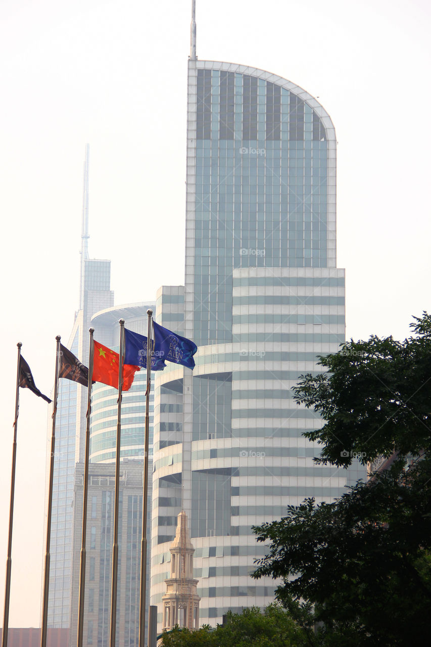 flags downtown shanghai. Just some flags in the wind in shanghai china.