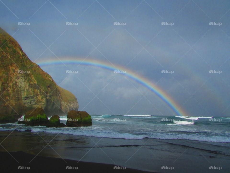 Double rainbows over beach