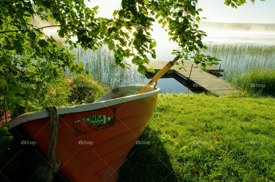 Vacation in Finland. we t for a walk along tge lake and found this boat.