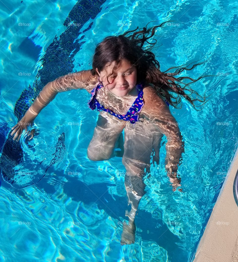 enjoying the pool in the summer