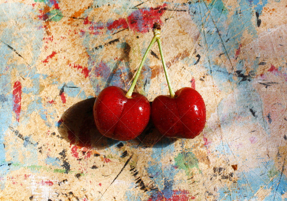 Cherry on colorful background