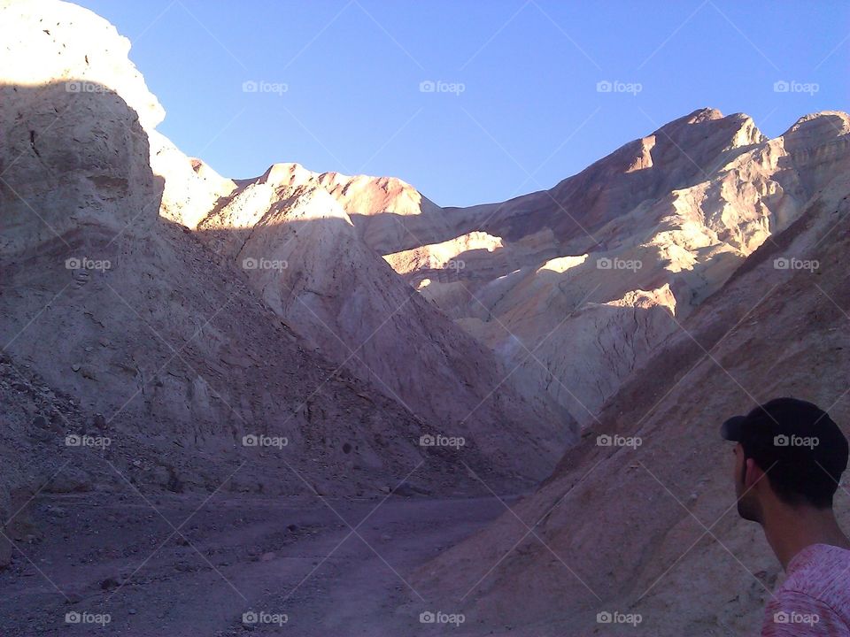 Looking on in a Canyon. A picture of a man looking on inside one of the canyons in Death Valley