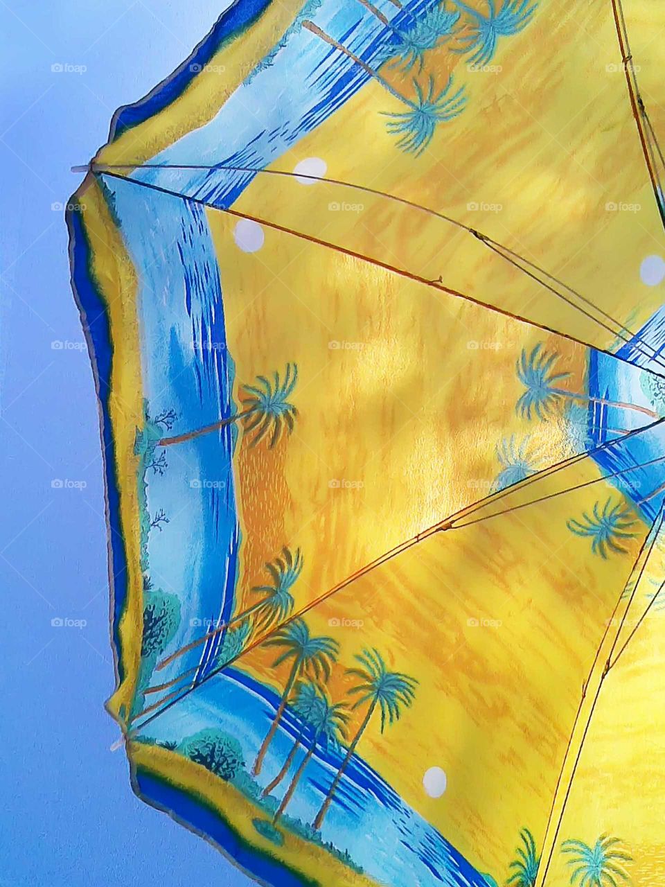 Yellow umbrella from below