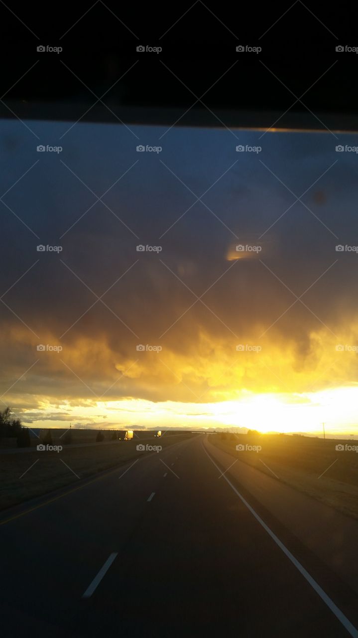 sunset times storm clouds into gold