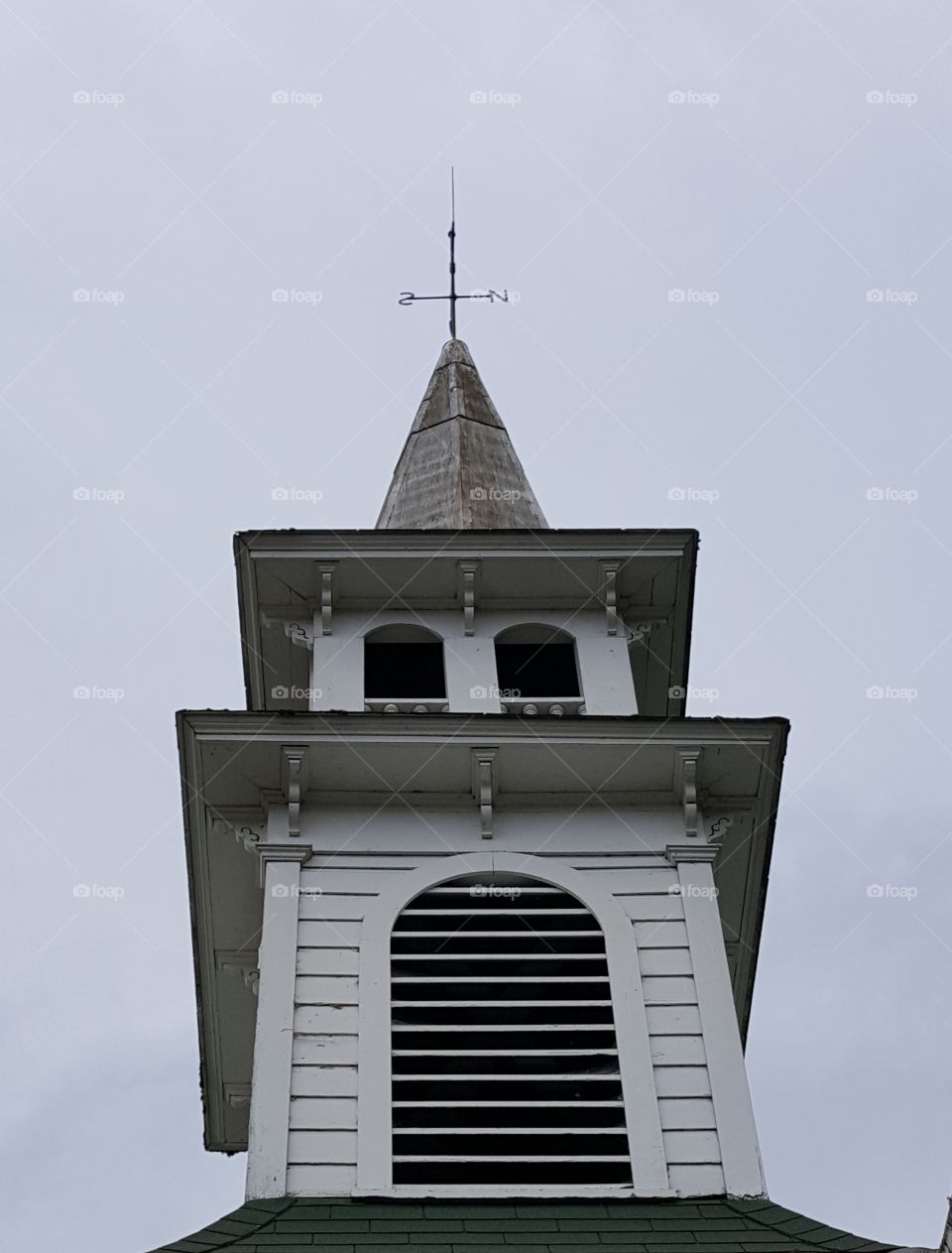 Steeple with Weather Vane on a Cloudy day