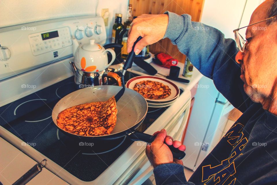 Daddy prepares breakfast