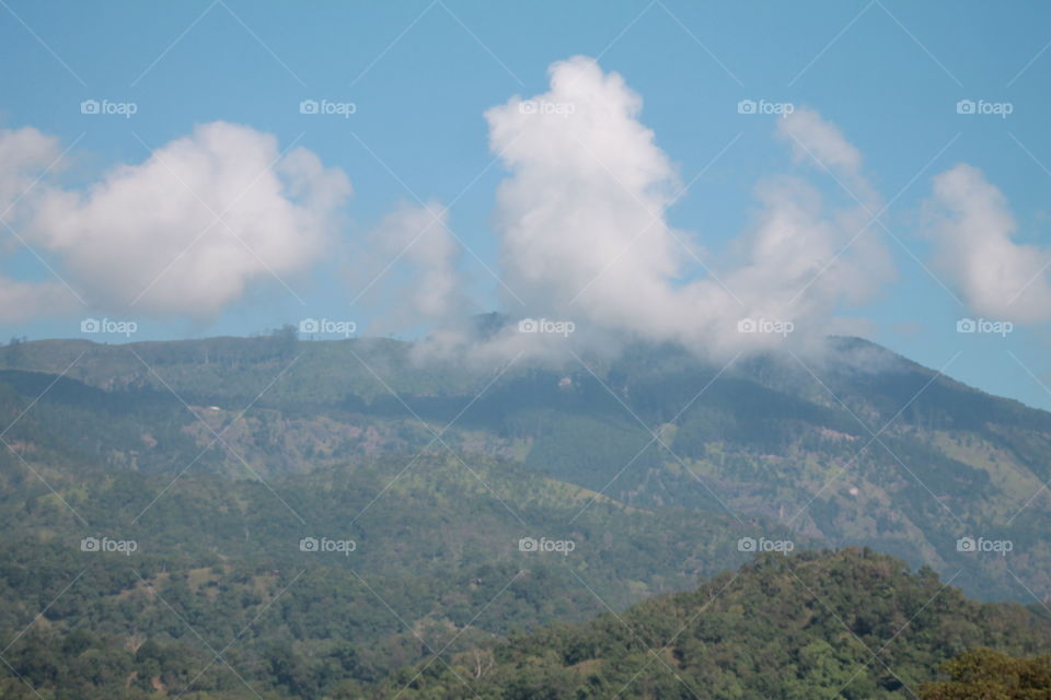 When a mountain meets the sky and clouds