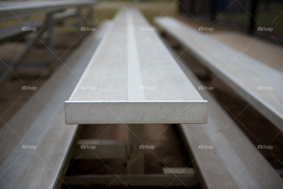 Close-up of a row of metal stadium bleachers