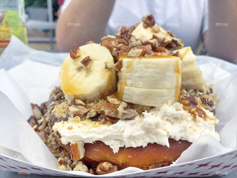 Donut dessert with bananas, Carmel and pecans 