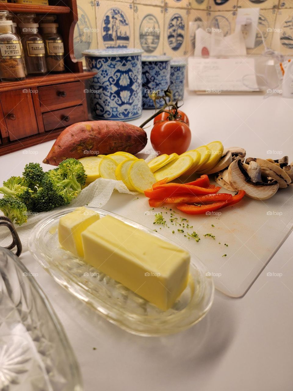 ingredients for supper sweet potato, broccoli, squash, red bell pepper, mushrooms, fresh tomato and butter