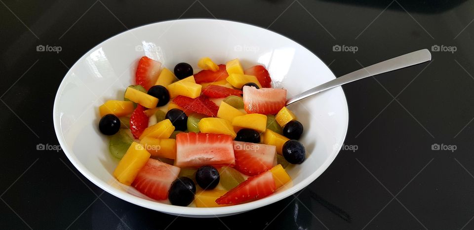 Colourful, tasty & healthy breakfast of yoghurt topped with fresh fruit