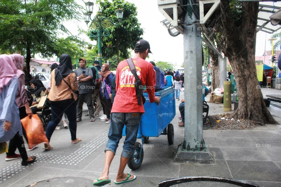 Man going to setup stall at Malioboro Yogyakarta
