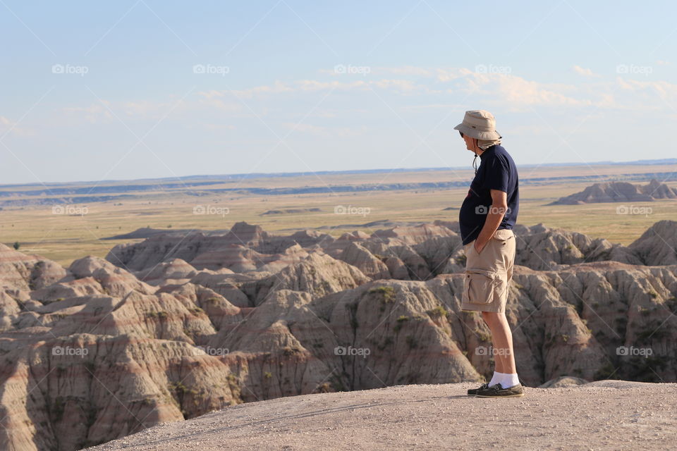 A man looking out onto the Badlands