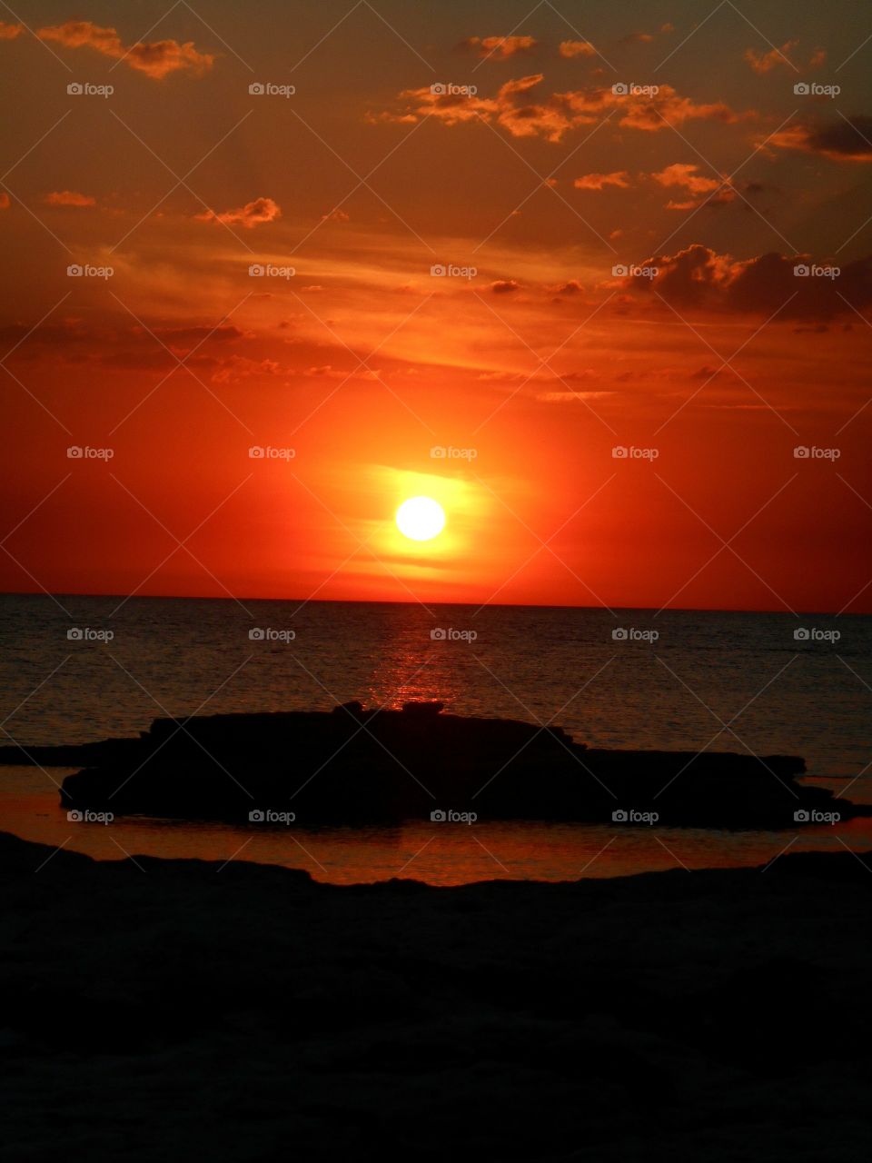 orange sunset on a sea shore summer time