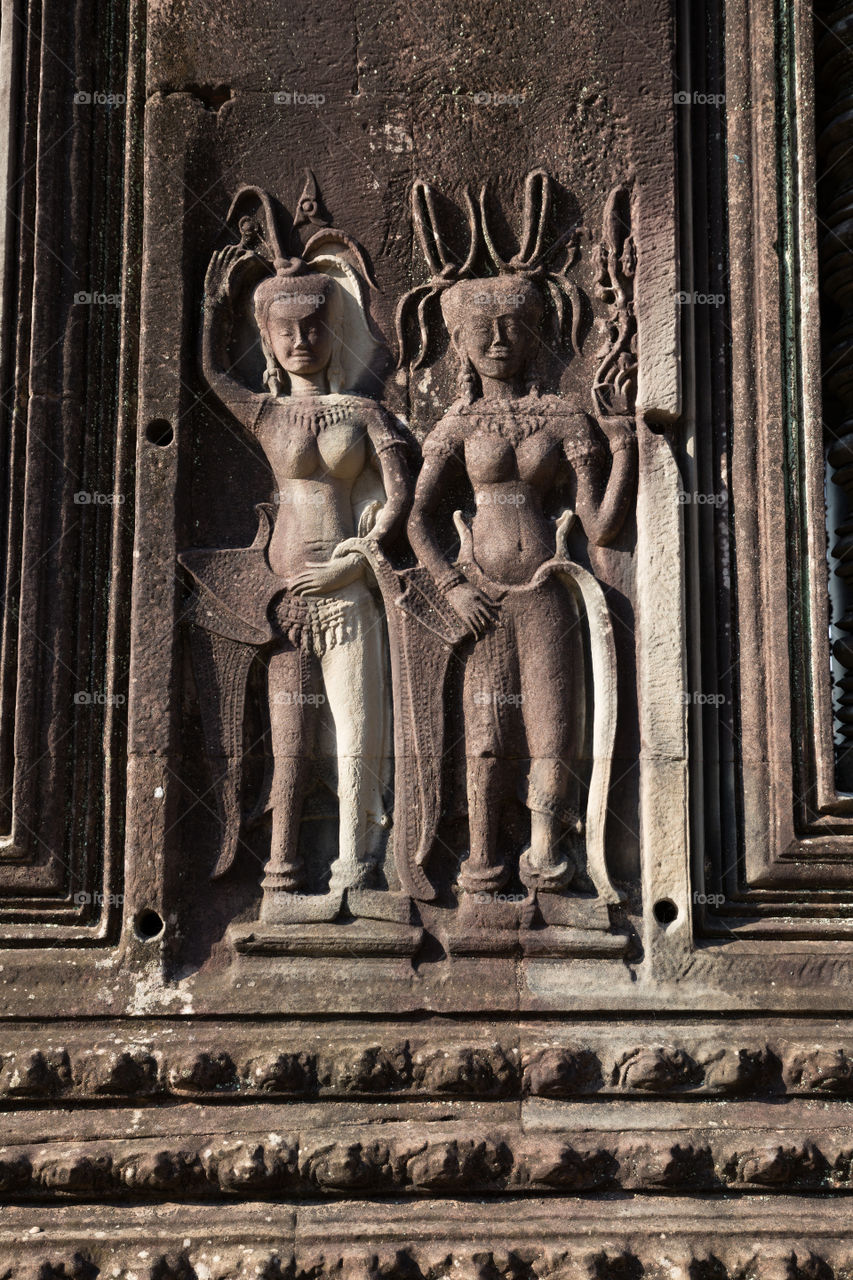 Old carving stone in Ankor Wat in Siem Reap Cambodia 