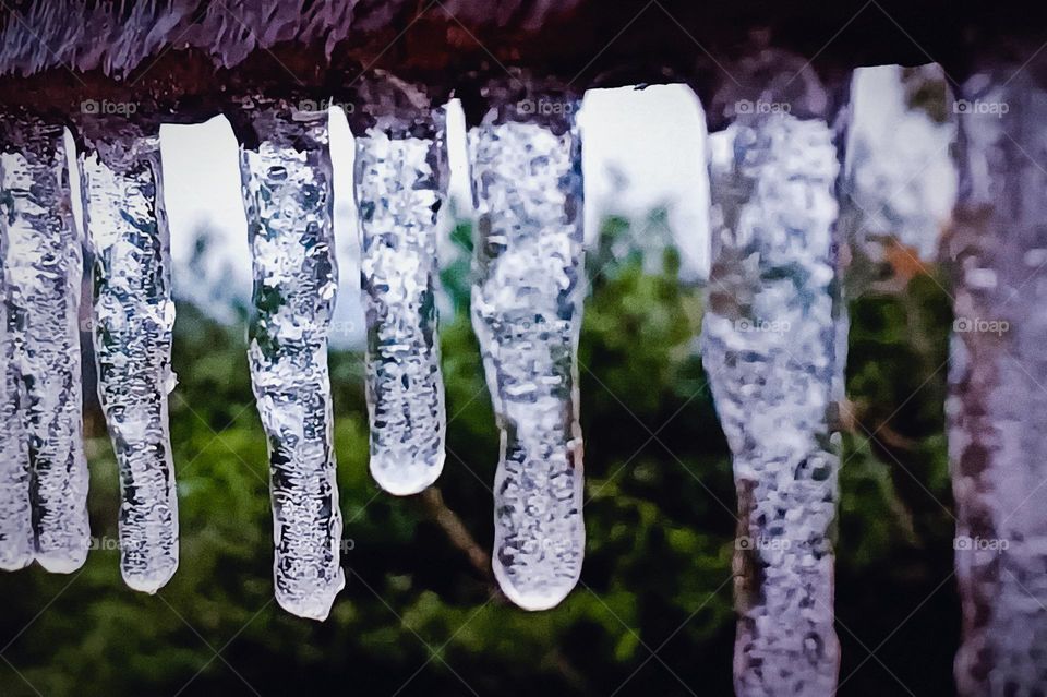 In cold weather, the low temperature causes water droplets to form icicles.