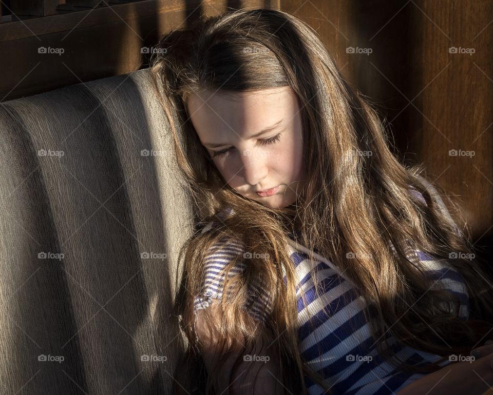 Girl resting in lights abs shadows 