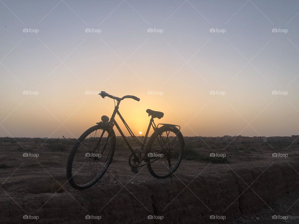 The bicycle against a beautiful sunset 