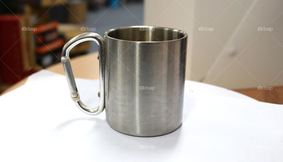 A cup or mug made of aluminum, usually used when camping