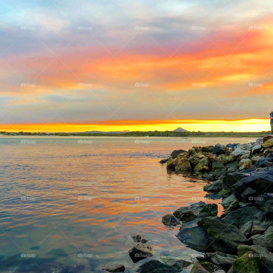 Sunset on the rocks at the river 