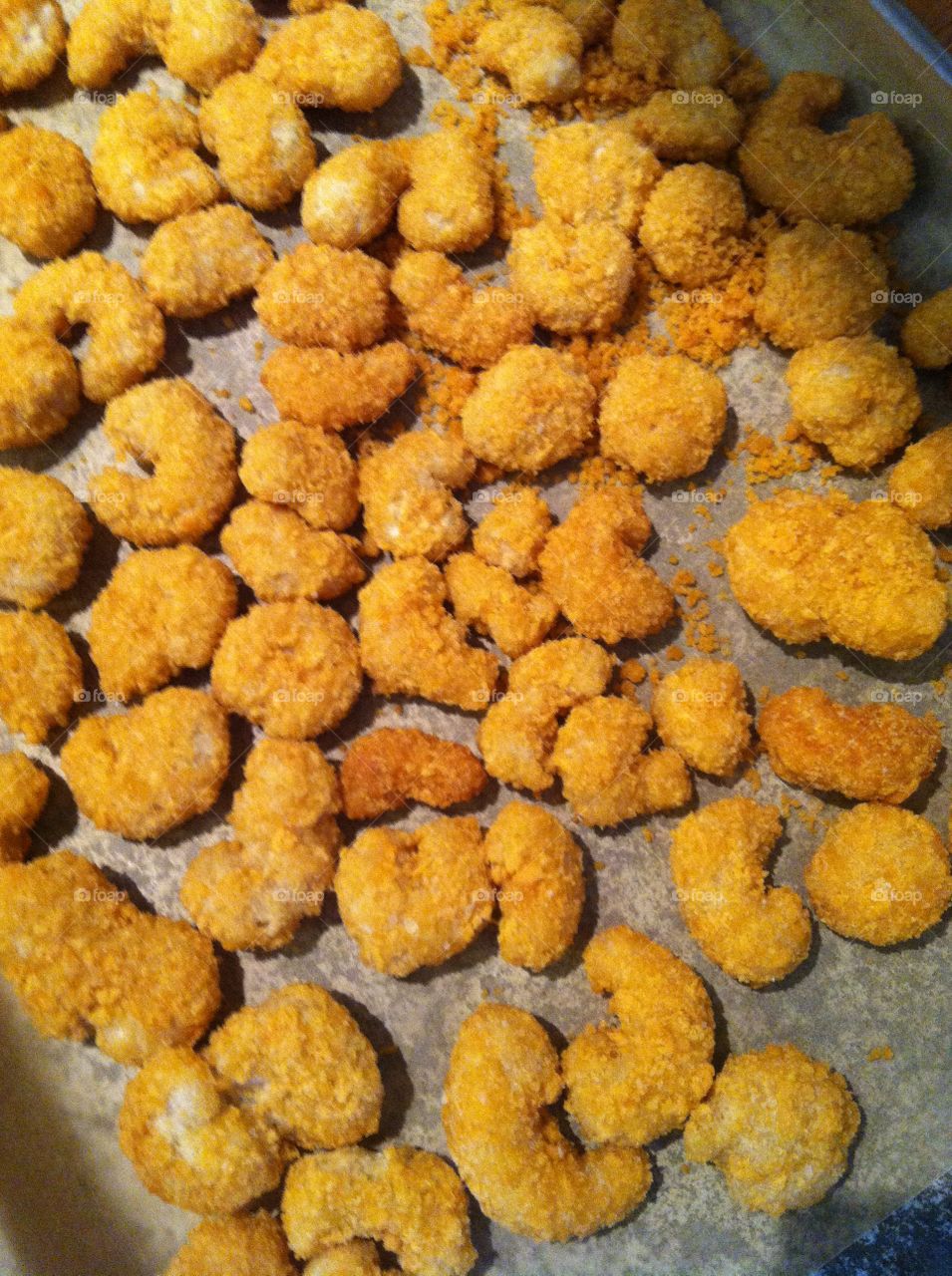 Fried shrimp. Popcorn shrimp on baking sheet