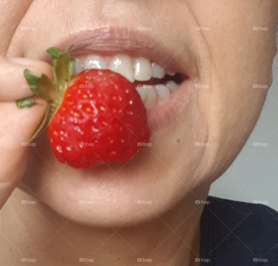 Eating strawberry