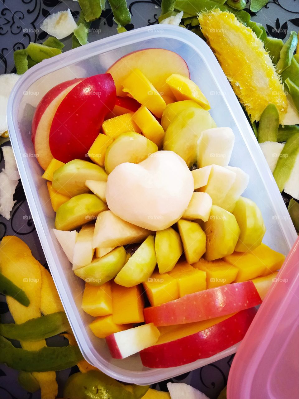 Fruits box with apples, mangoes, yam bean, ambarella.