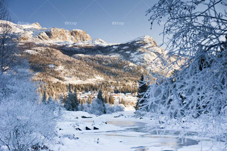 Snowbound landscape mountain river. Hemsedal, Norway. November