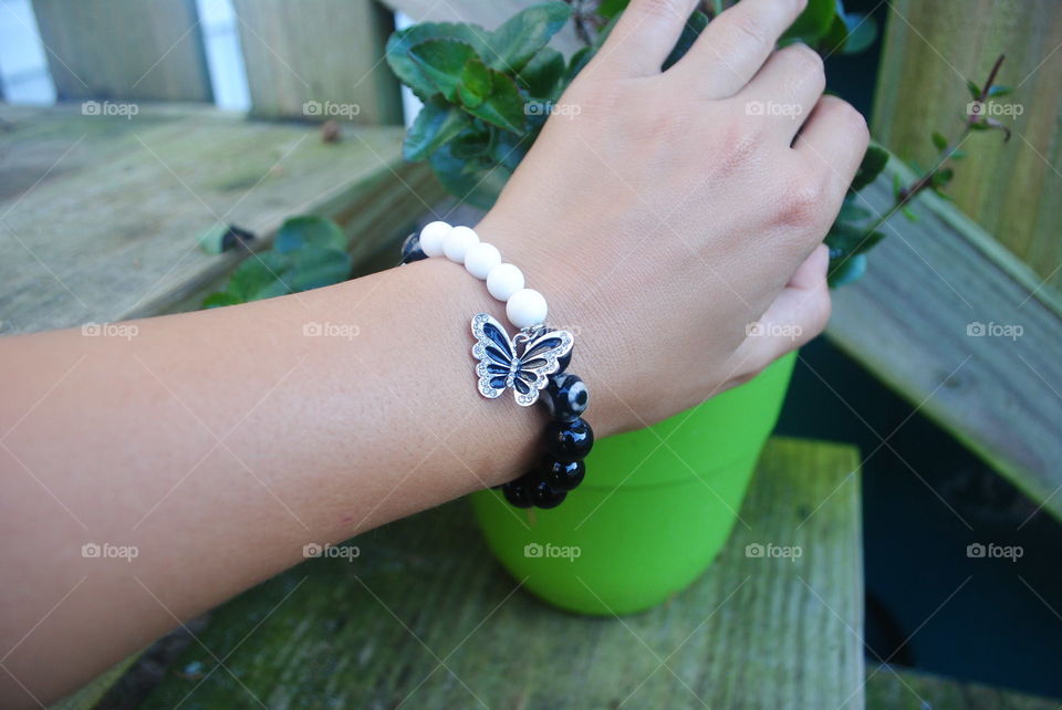 A beautiful handmade bracelet with a butterfly pendant