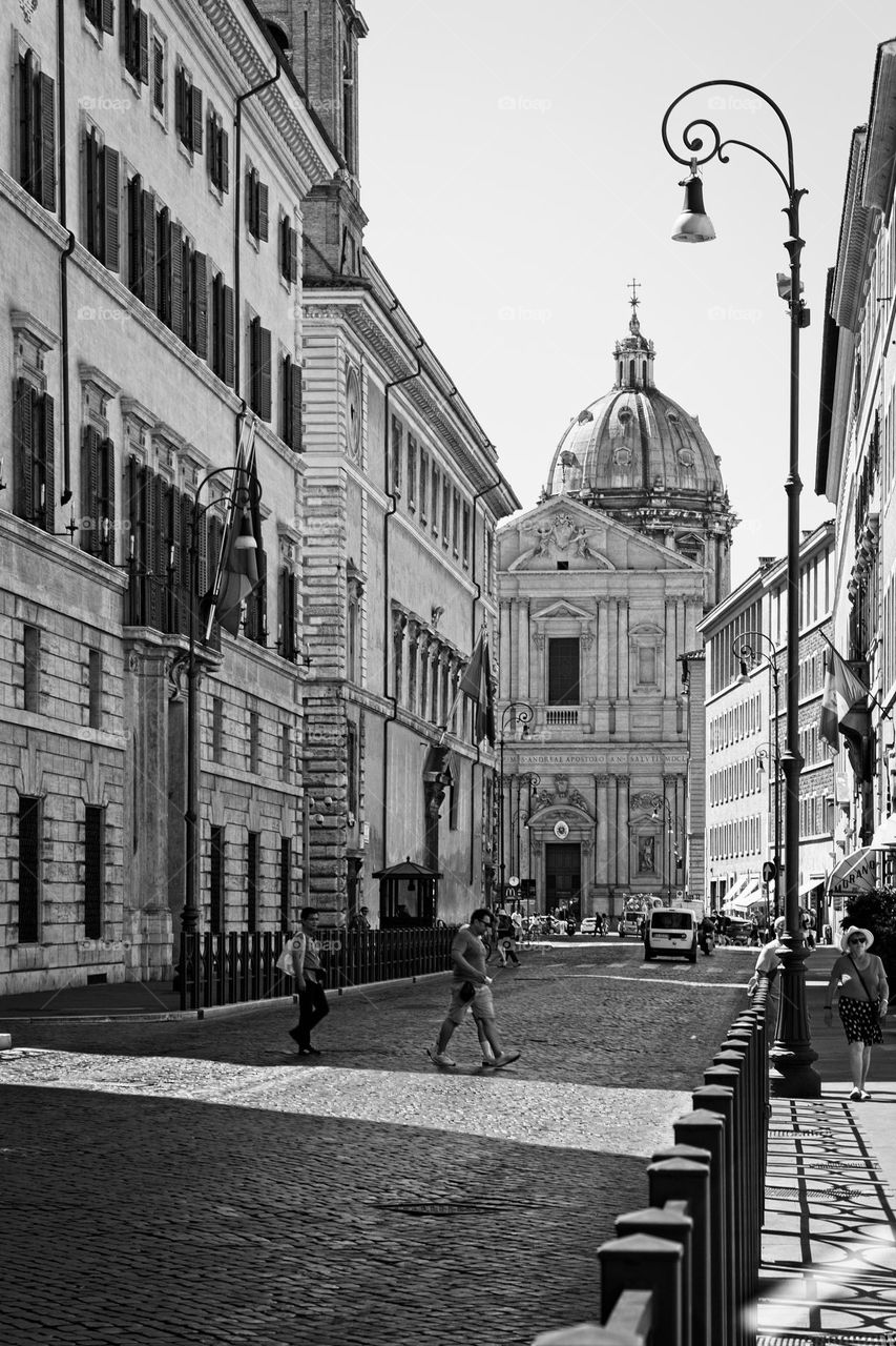 Street in Rome with a cathedral in the background 