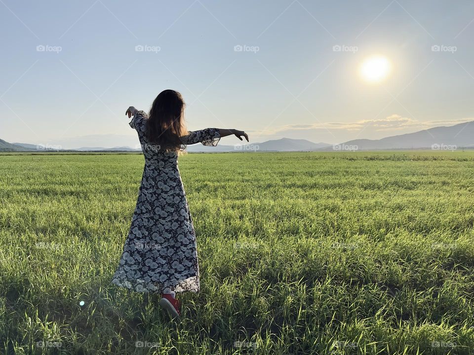Woman in a green field 