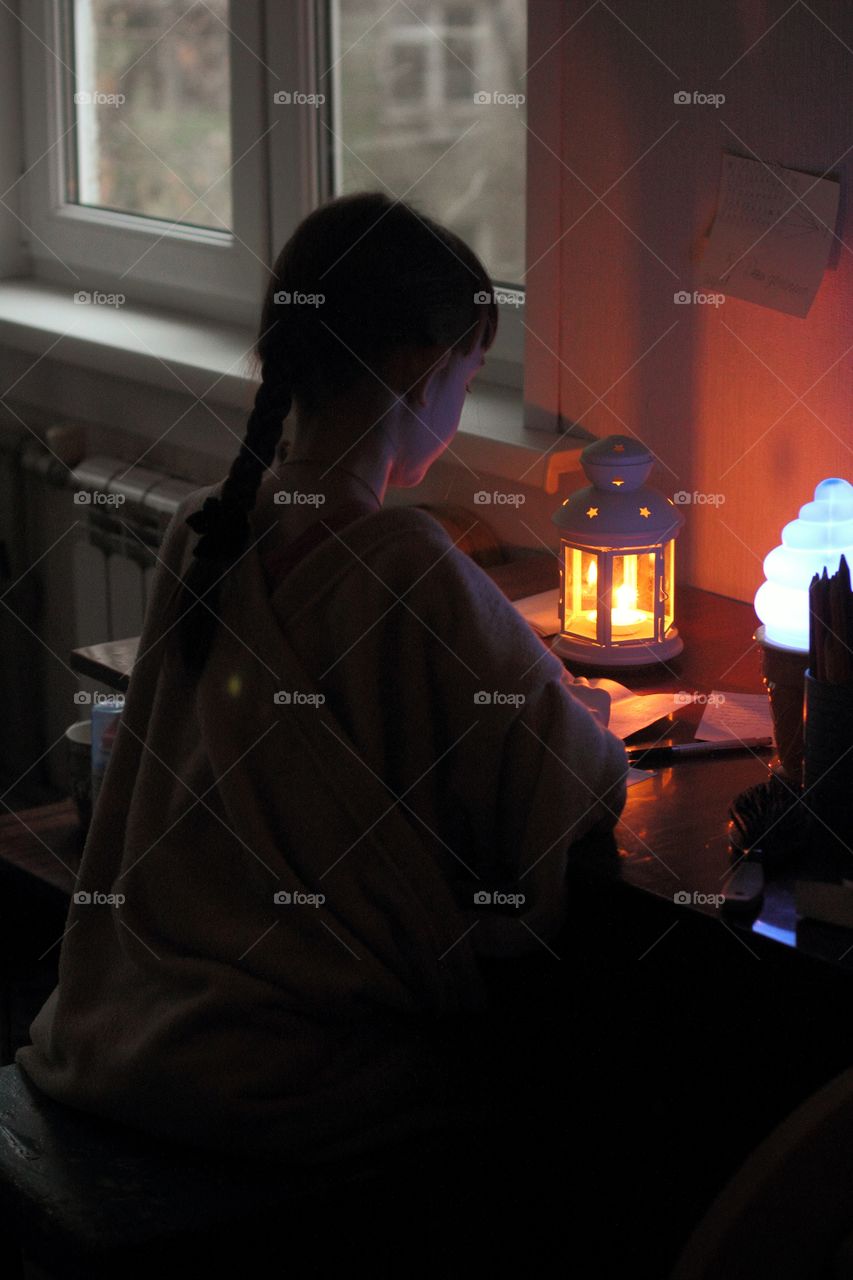 Little girl prepares for the holiday and writes a letter to Santa Claus