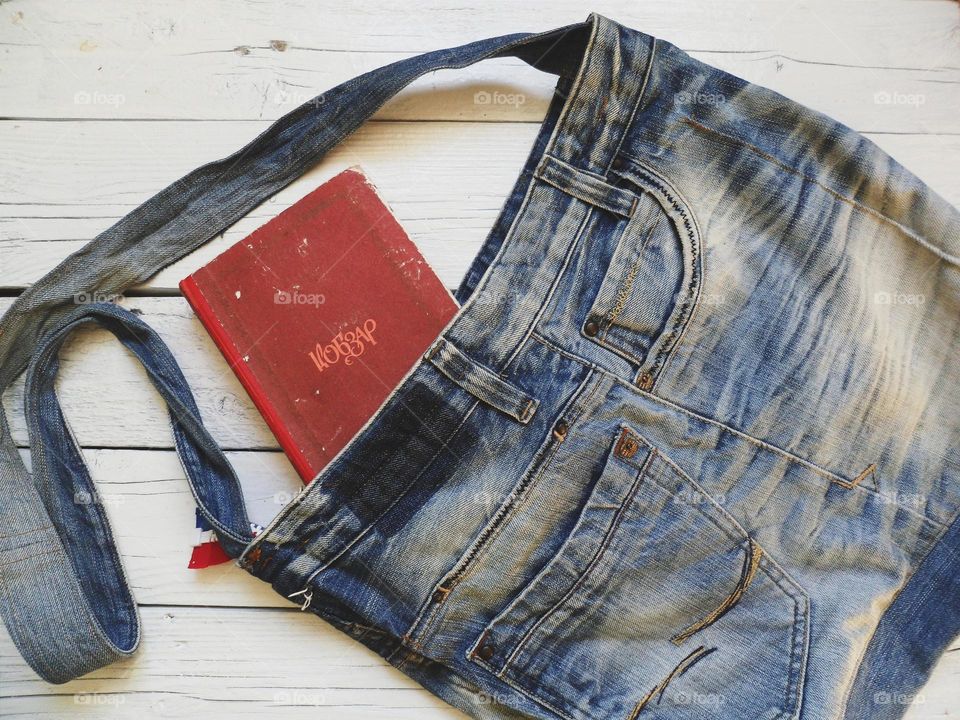 Denim bag and old book