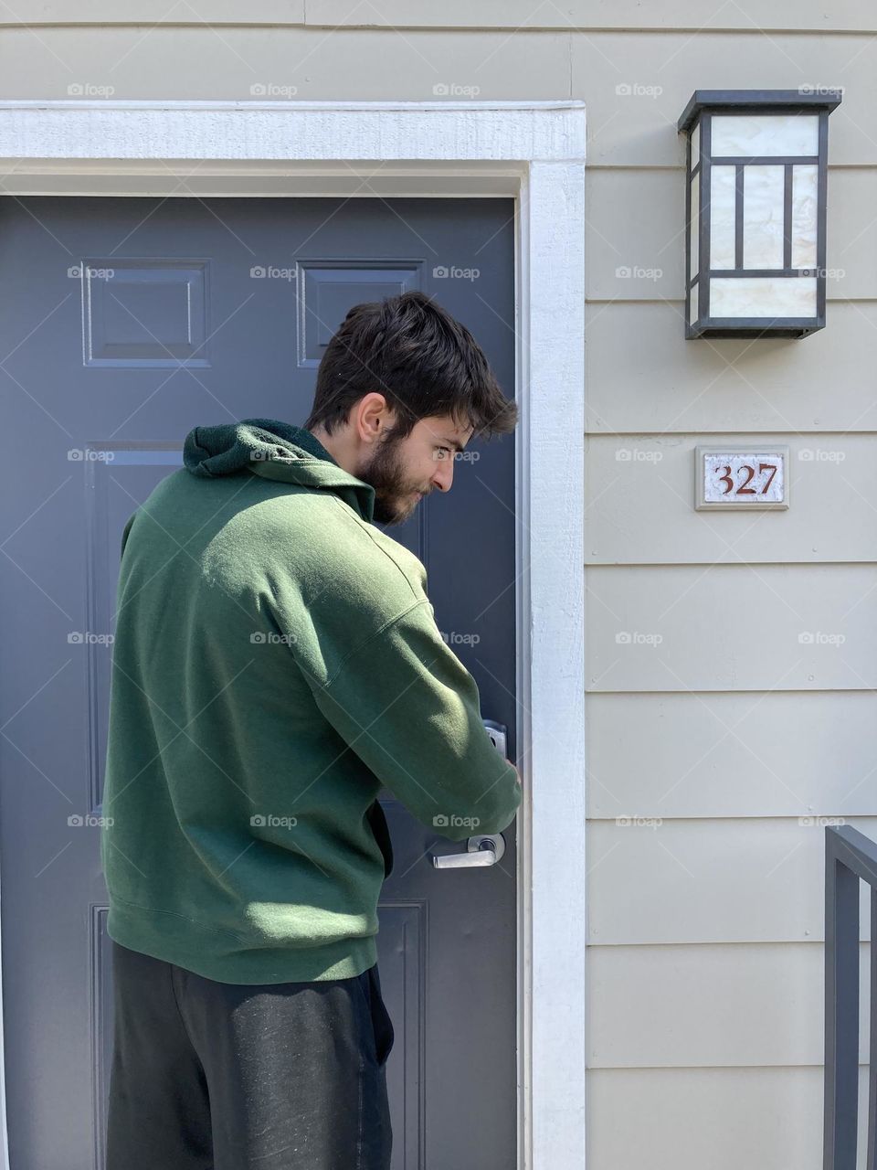 Unlocking the  new apartment door for visitors 